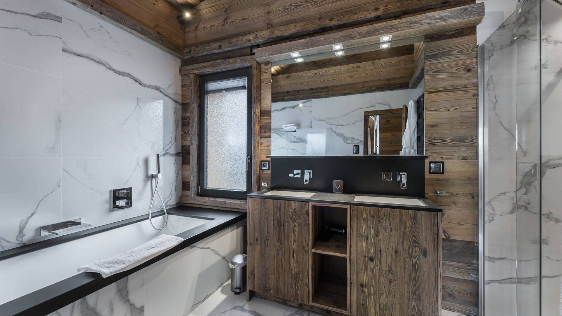 en suite bathroom with double lavabo, bath tub and shower cabin