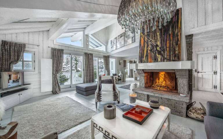 spacious living room with fireplace and majestic view over Courchevel