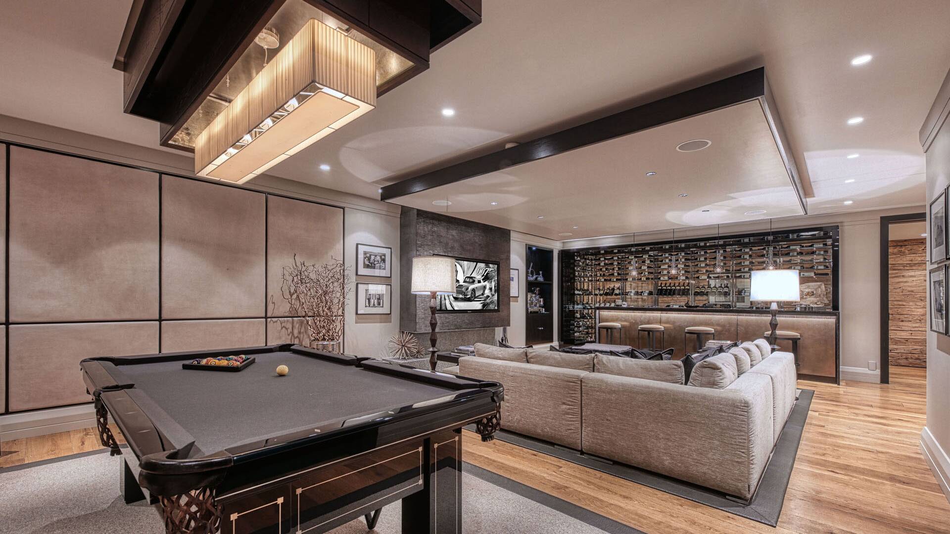 exclusive lounge area with bar and billiard table