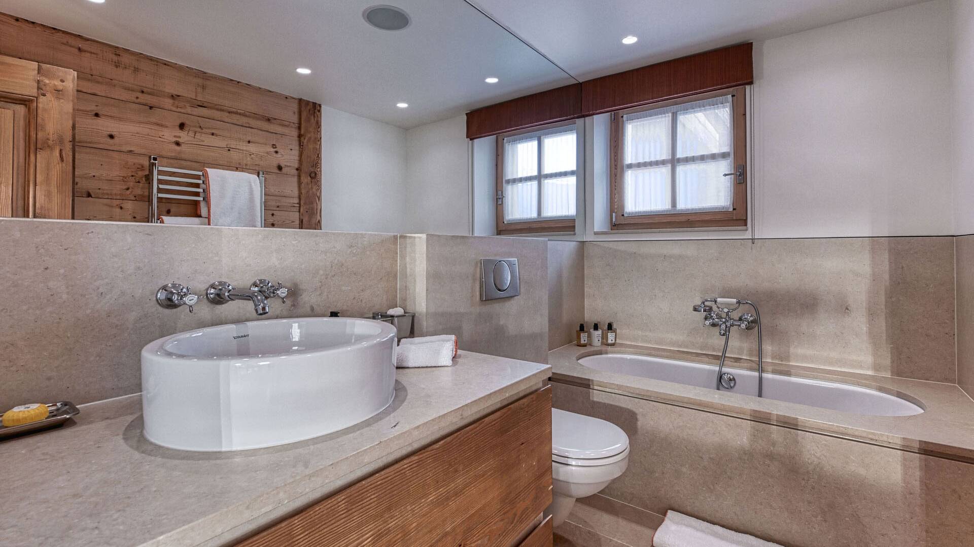 en suite bathroom with bath tub