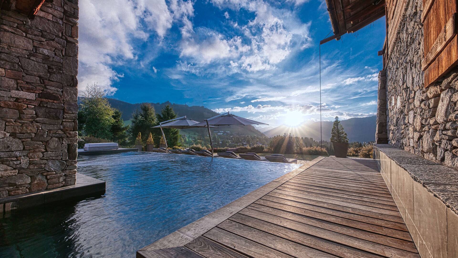 luxury indoor/outdoor swimming pool with sunbeds