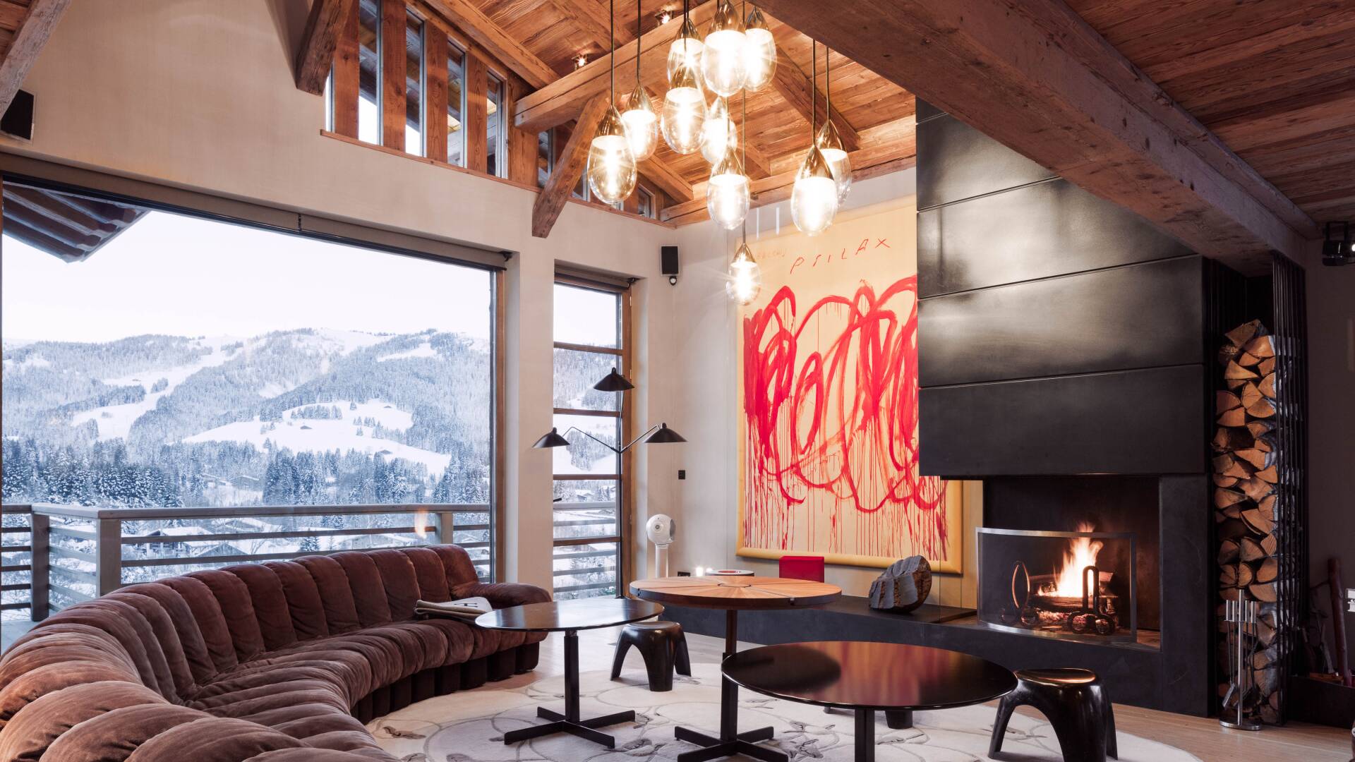 living room with large sofa, fireplace and French windows