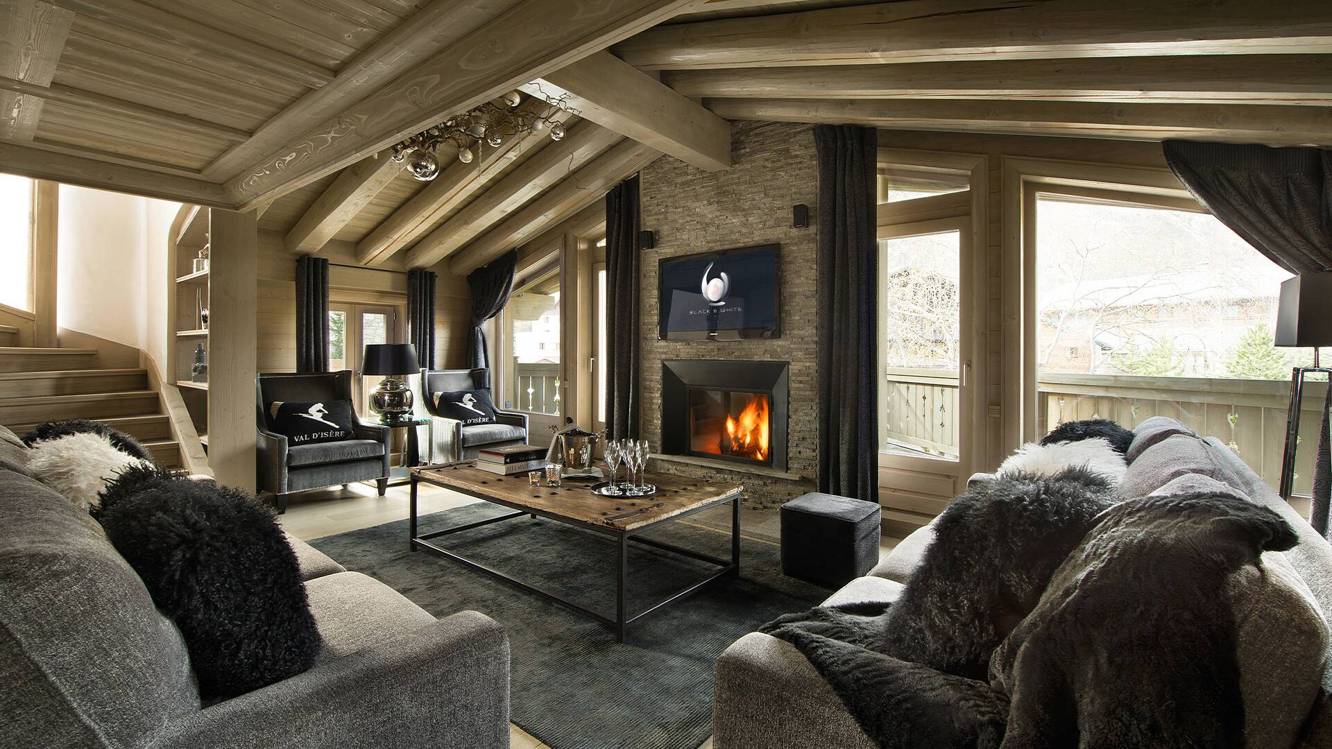 contemporary living room with majestic windows, TV and fireplace