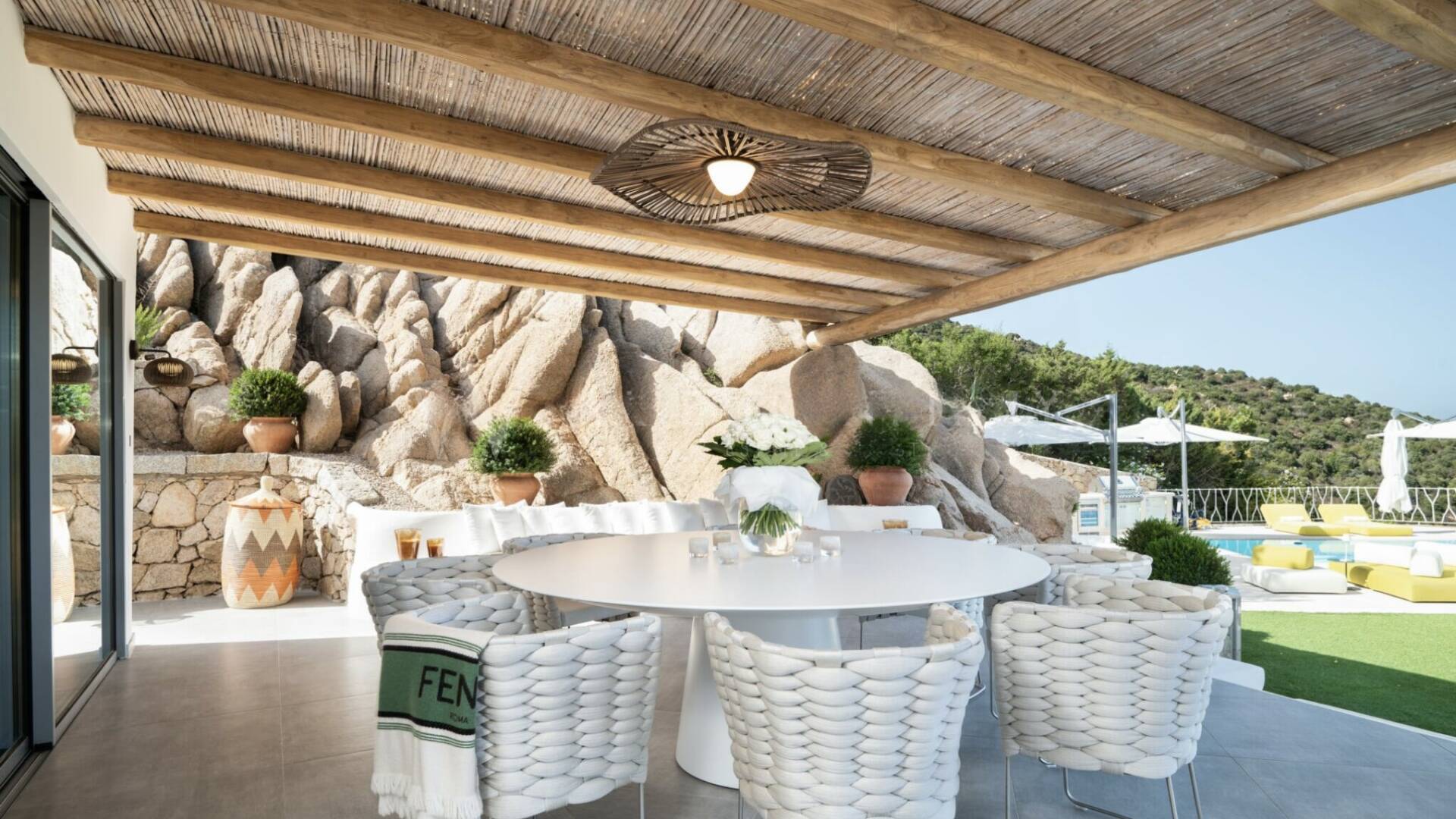 luxurious alfresco dining area with pool and sea view 