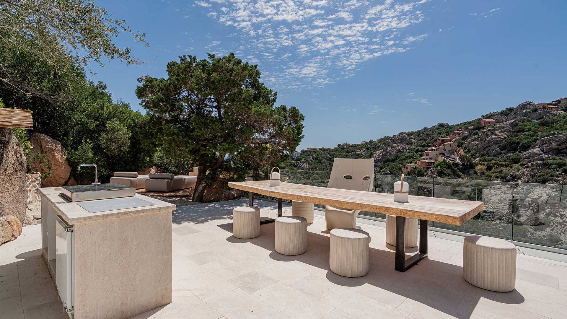 outdoor kitchen with al fresco dining table