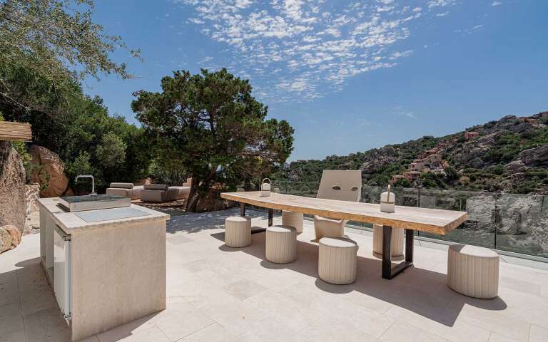 outdoor kitchen with al fresco dining table