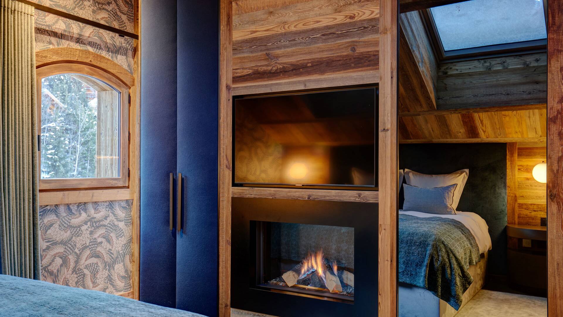 double bedroom with TV and fireplace