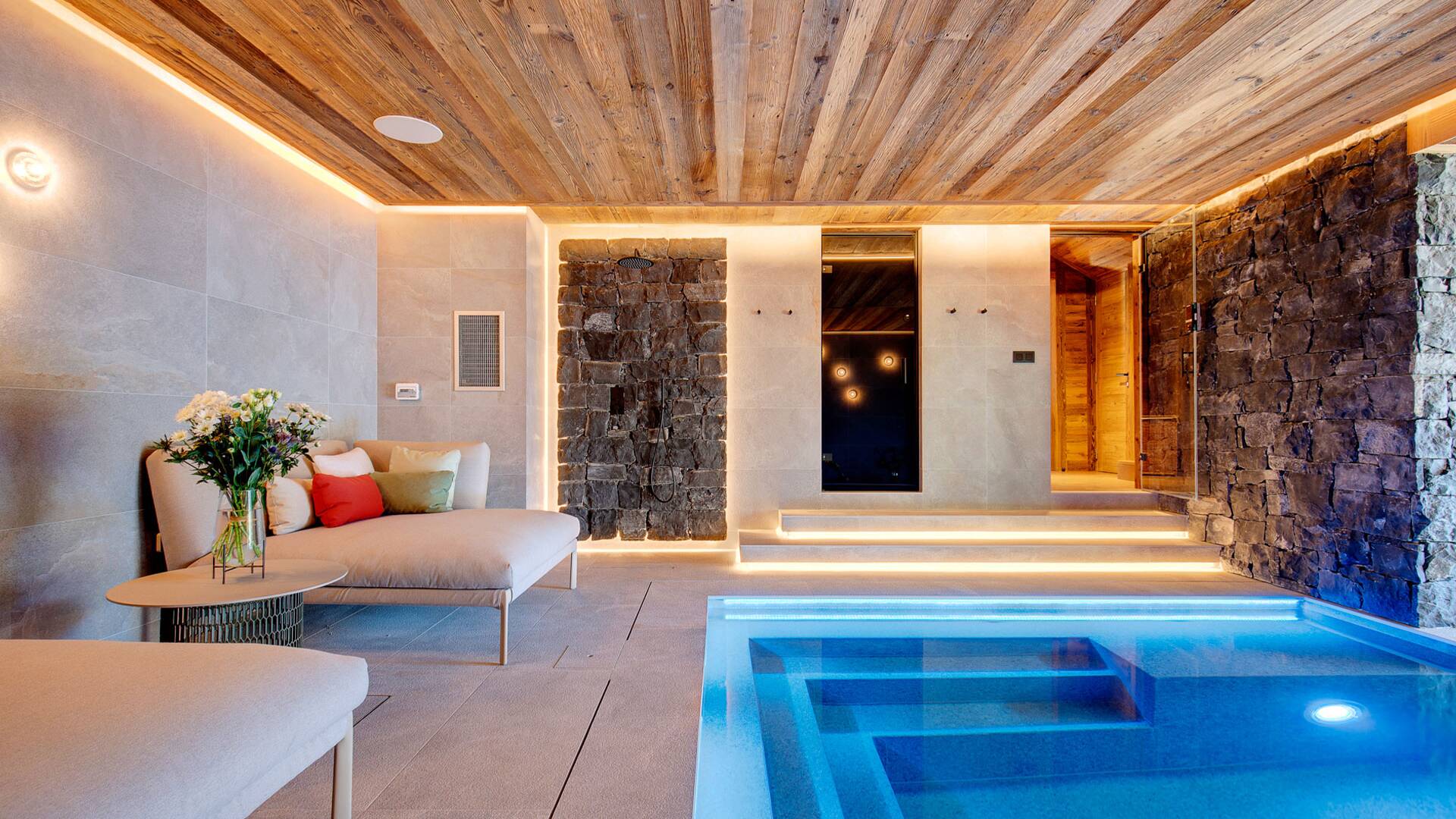 luxury indoor pool with deckchairs