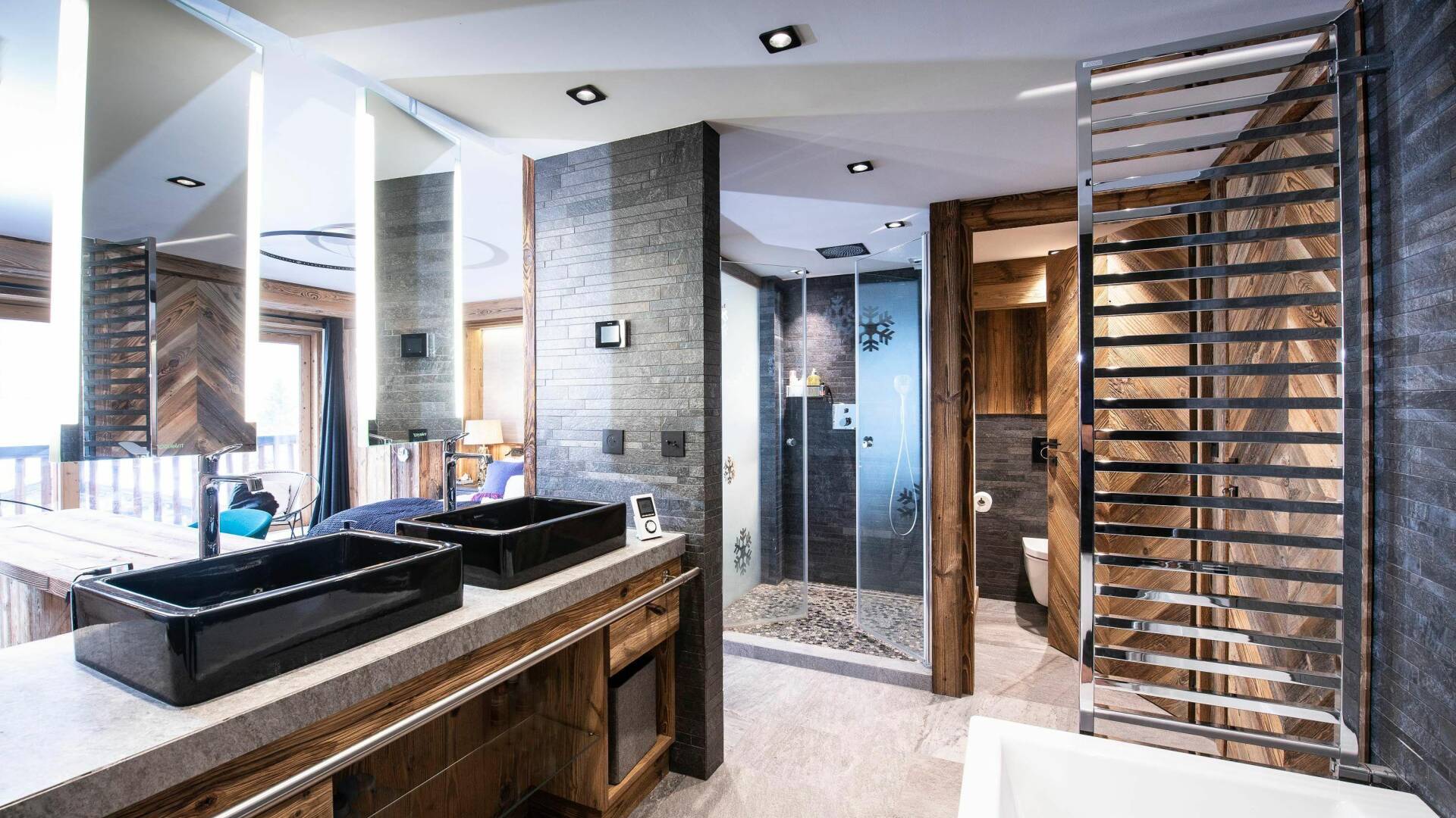 en suite bathroom with double lavabo, bath tub and shower cabin