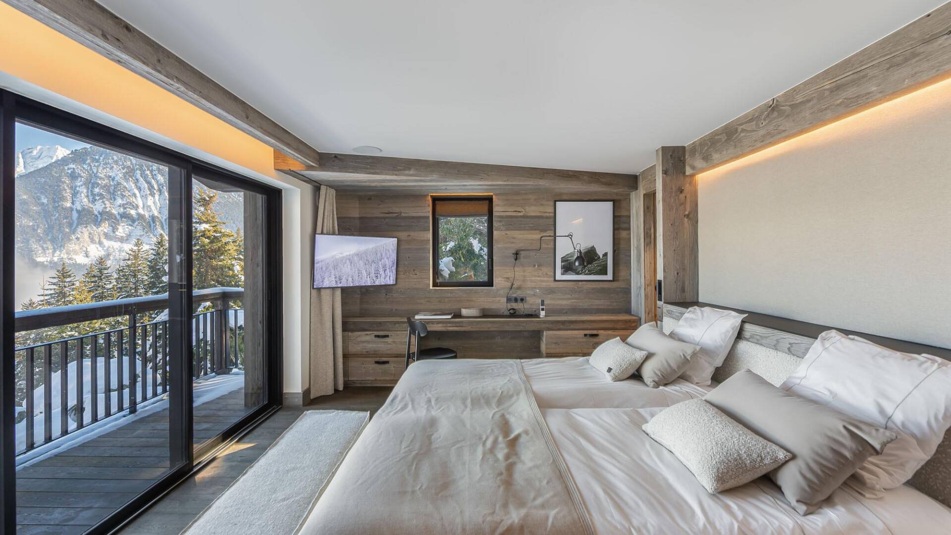 bedroom with TV and balcony