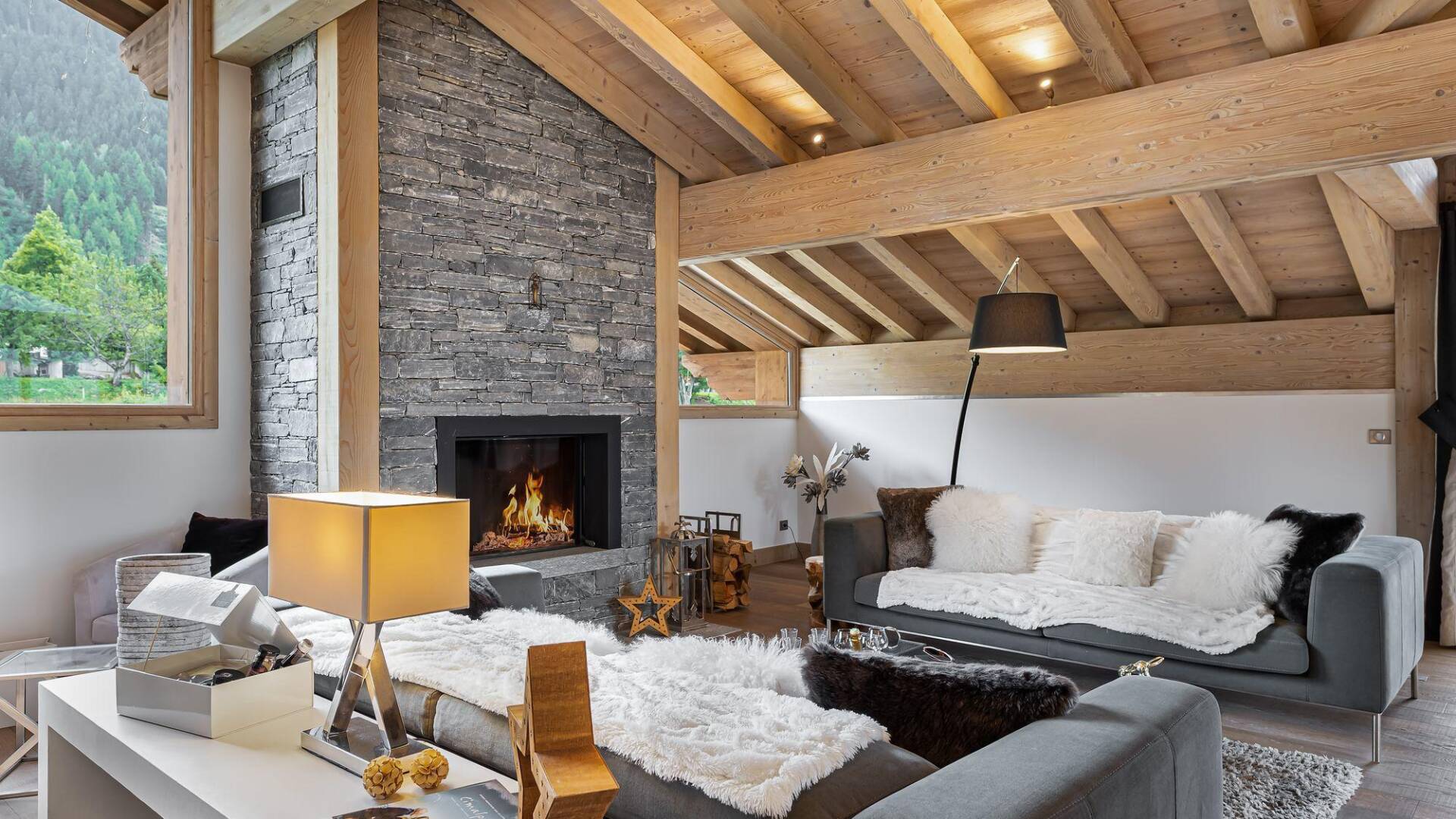 cosy living room with plush pillows and modern fireplace