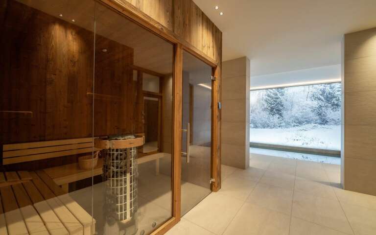 private wellness area with sauna and indoor pool