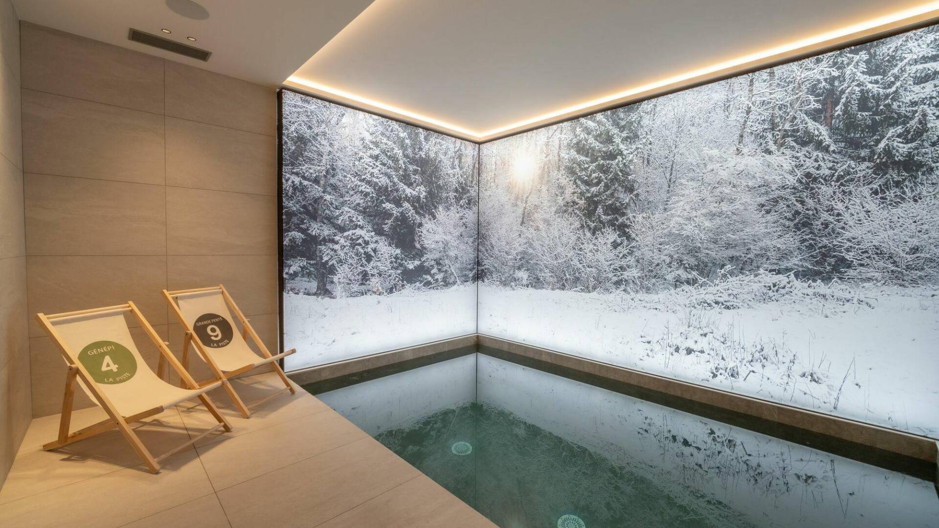 luxury indoor splash pool with decorated wallpaper