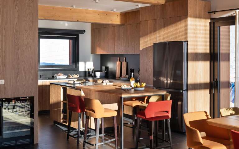 gourmet kitchen with cooking island and stools